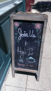 Chalkboard sign inviting to join High P's from 7 to 11 pm.
