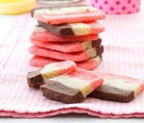 Colorful layered ice cream cookies on a pink cloth.