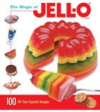 A colorful layered Jell-O dessert with fruit and cookies.