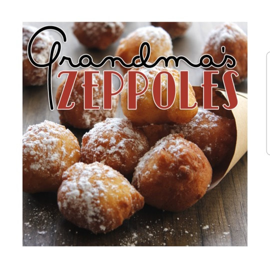 Close-up of powdered Grandma's zeppoles piled up.