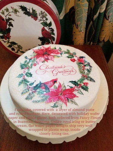 A round cookie decorated with colorful fruit and clothing illustrations.