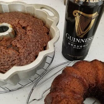 Two chocolate bundt cakes with a can of Guinness stout beside them.
