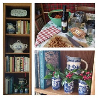 Cozy rustic kitchen shelves with teapots, books, pasta, and decorative jars.