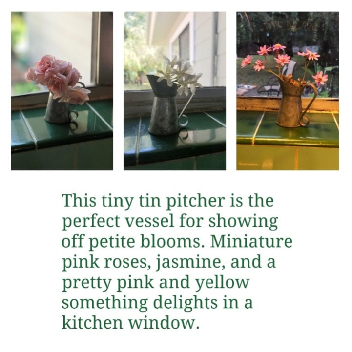 A tiny pitcher holding miniature pink roses on a windowsill.