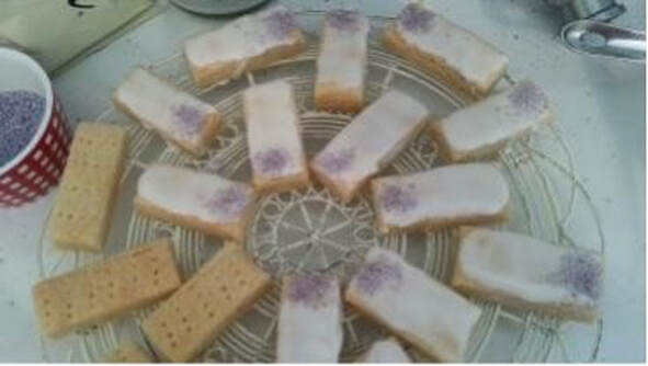 Biscuits with a creamy filling arranged on a lace doily.