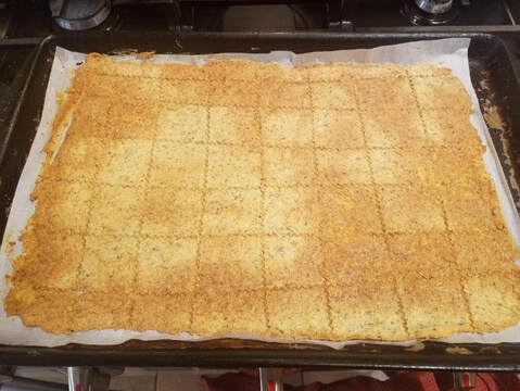 A tray of freshly baked, cut cinnamon sugar crackers.