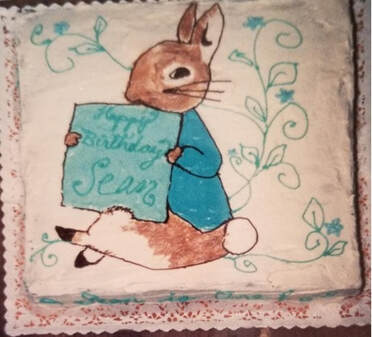 A vintage-style Easter bunny holding a sign that says 'Happy Easter'.
