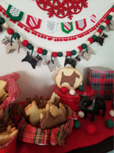 Festive Christmas cookies shaped like horses with holiday decorations.