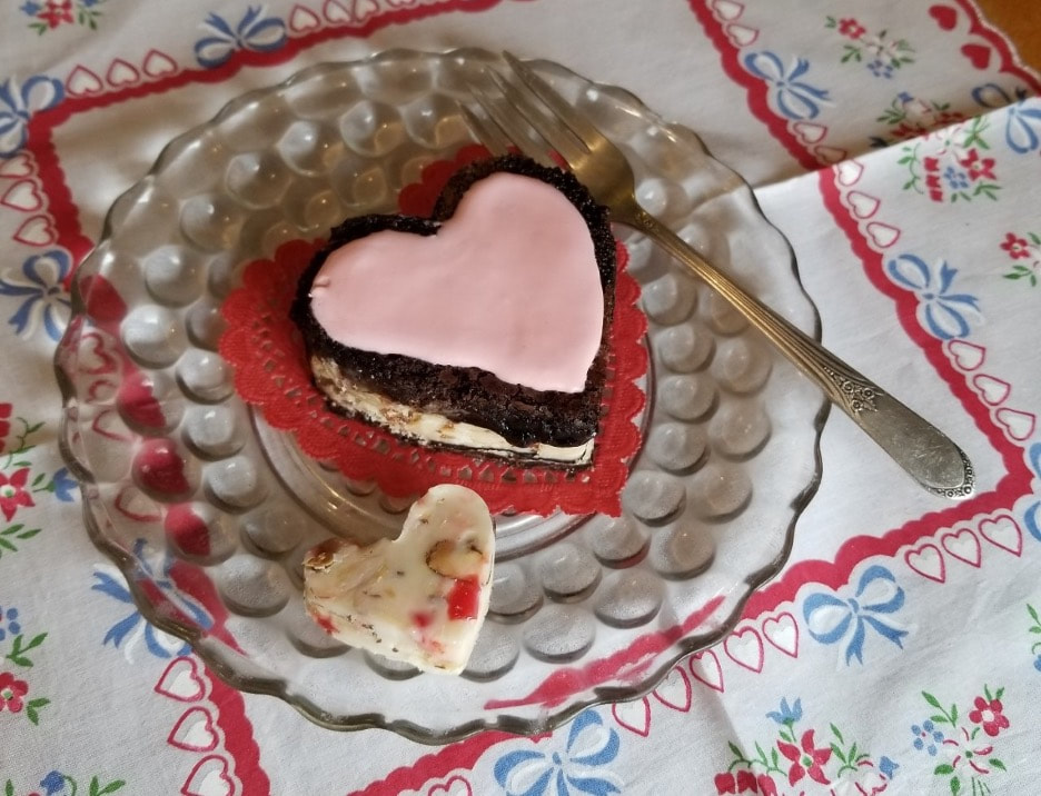 Delicious heart and bird-shaped cookies on elegant plates.