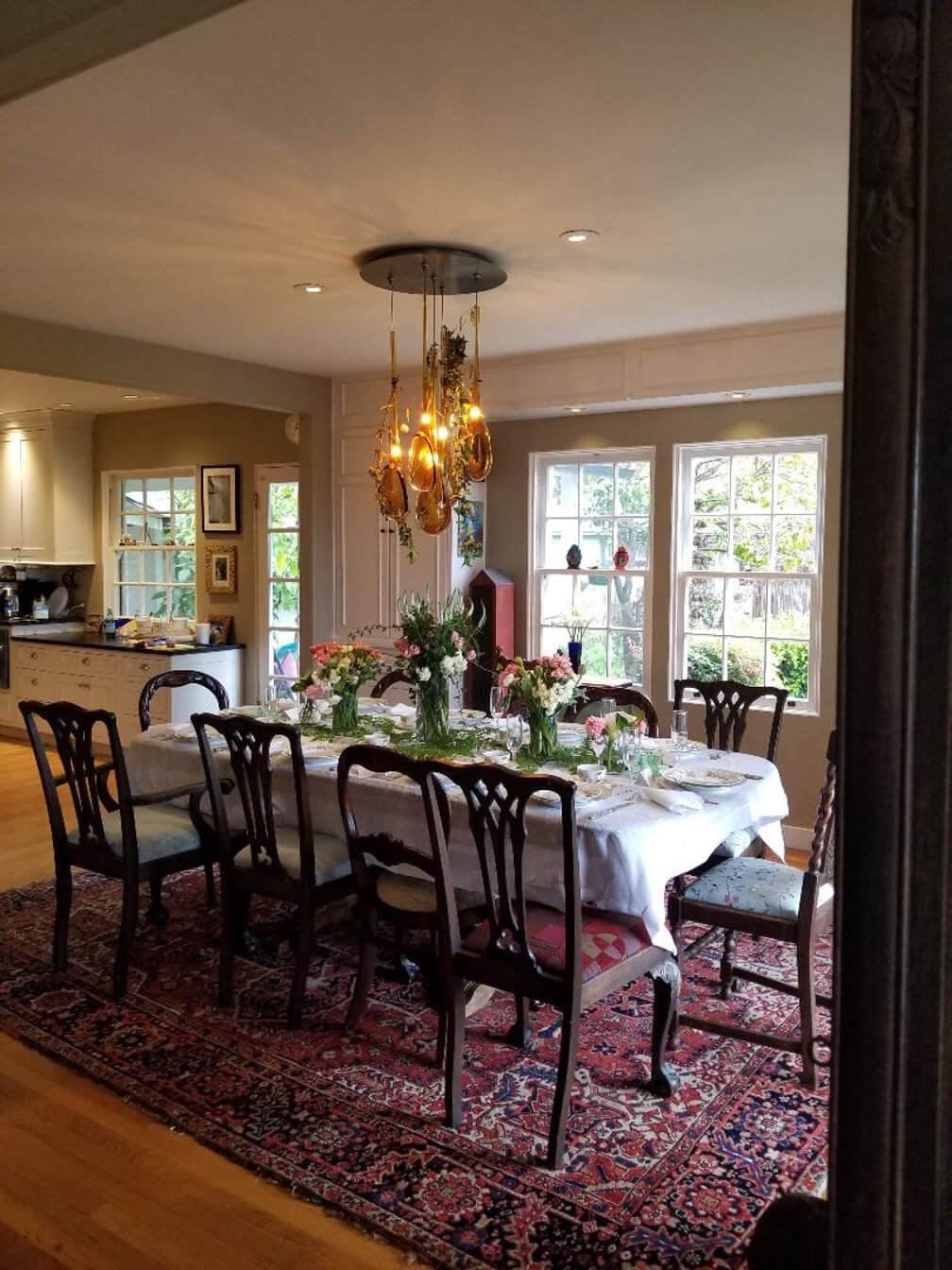 Elegant dining room with a beautifully set table and warm lighting.