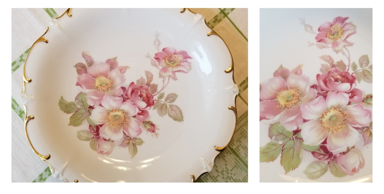 Decorative porcelain plate with pink floral design and gold trim.