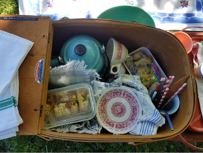 A box filled with assorted kitchenware and household items.