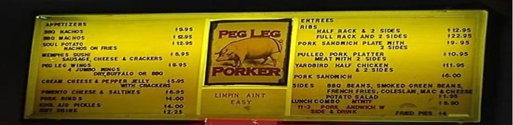 Signboard for Peg Leg Porker barbecue restaurant with pig illustration.