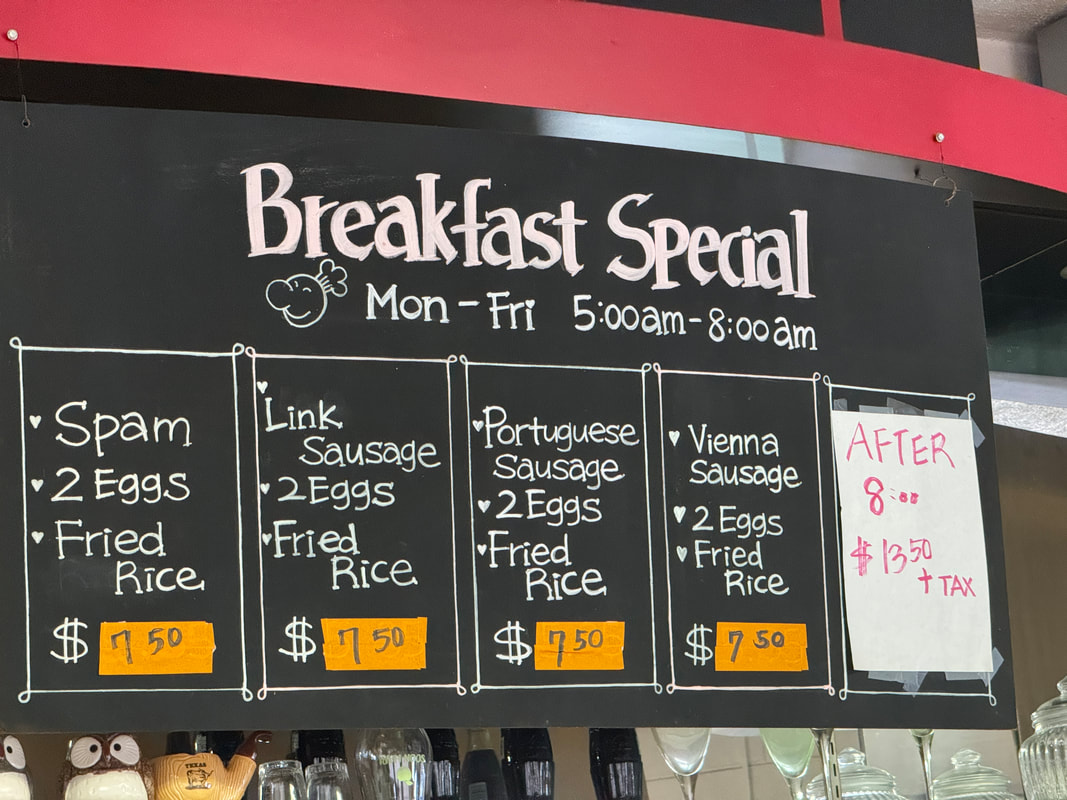 Breakfast special menu with various egg and meat options and prices.