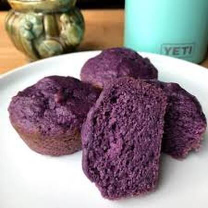 Purple sweet potato muffins on a white plate.