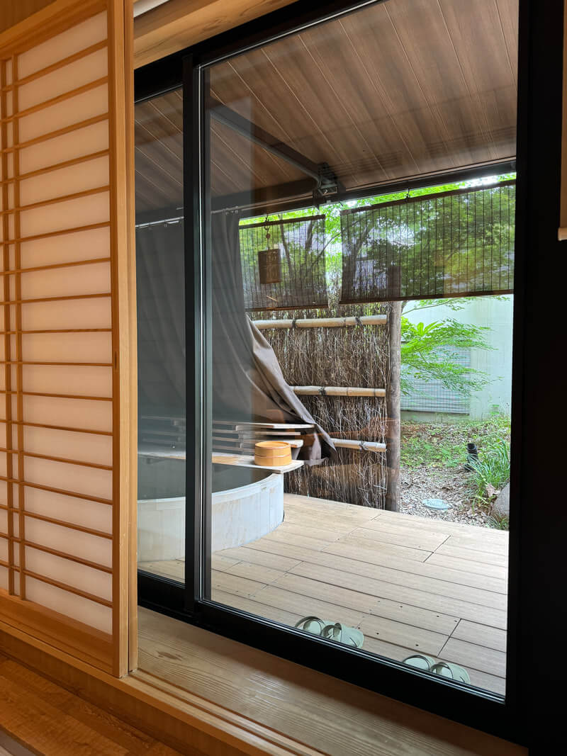 Tranquil Japanese-style outdoor fireplace with natural surroundings.