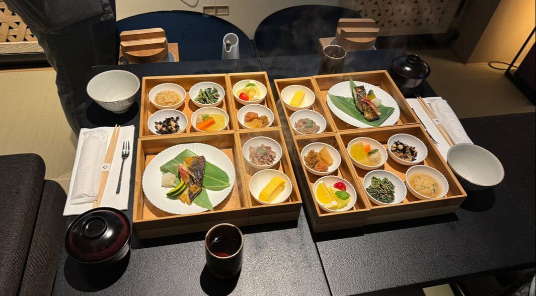 Traditional Korean meal with diverse side dishes and grilled meat.