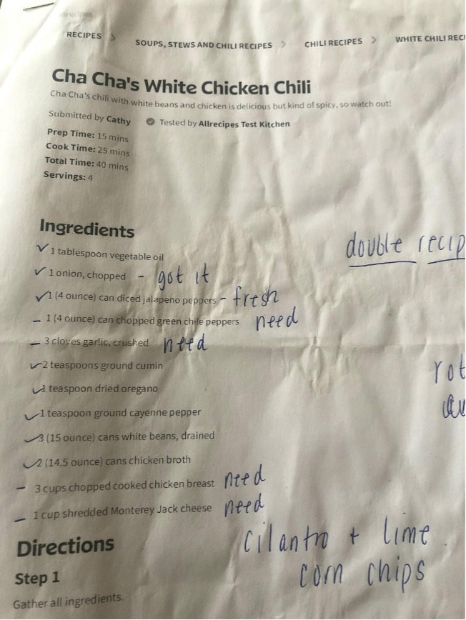 A crumpled recipe page for White Chicken Chili with handwritten notes.
