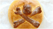 Bread loaf with a skull and crossbones design on top.