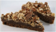 Two pecan-topped dessert bars on a white plate.