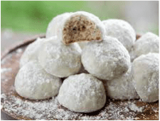 Powdered sugar-coated cookie balls with a nutty filling inside.
