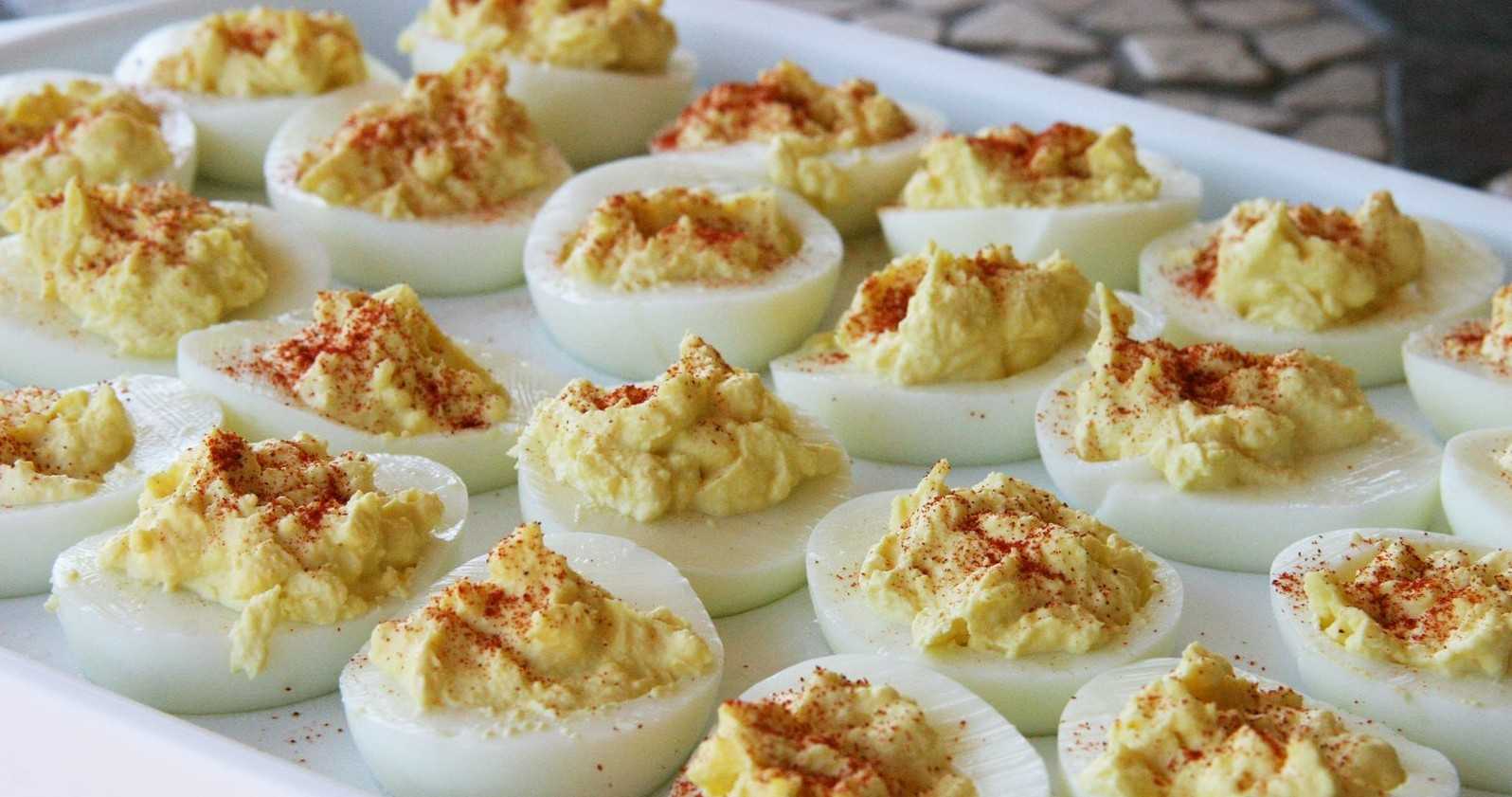 Close-up of deviled eggs garnished with paprika.