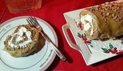 A slice of cake on a festive plate with a fork beside it.