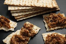 Pieces of matzah topped with a spiced meat mixture.