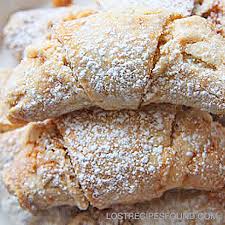 Close-up of powdered sugar-dusted pastries.