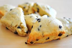Freshly baked chocolate chip scones on a plate.