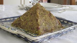 A pyramid-shaped mound of food on a plate.