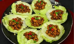 Lettuce cups filled with seasoned minced meat and vegetables.