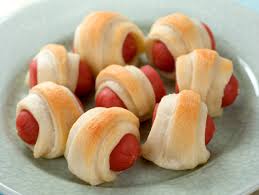 Mini pigs in a blanket appetizers with cocktail sausages.