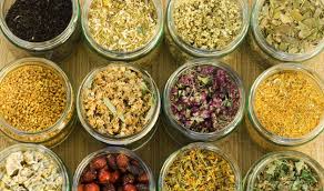 Jars filled with various dried herbs and flowers.