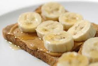 Peanut butter toast topped with banana slices.