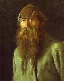 Portrait of a bearded man in a cap with intense eyes.