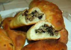 Golden-brown pastries filled with a savory mushroom mixture.