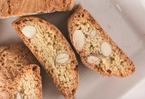 Close-up of almond biscotti slices with visible almond pieces.