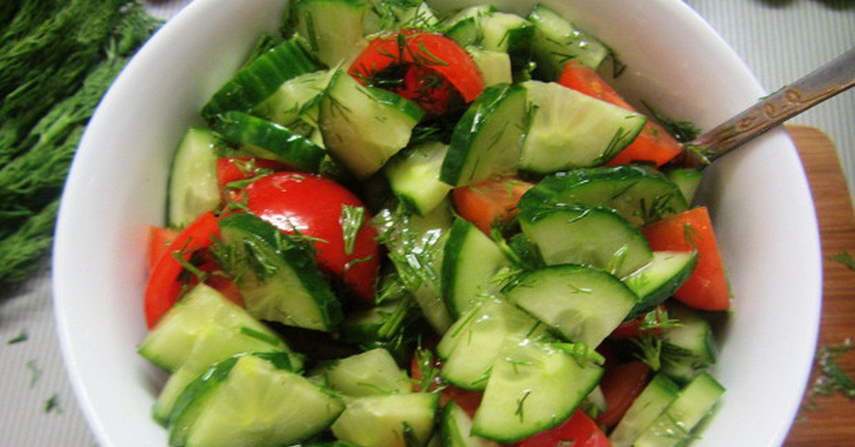 Fresh cucumber and tomato salad with herbs.