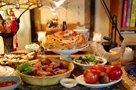 A festive dining table filled with diverse dishes and drinks.