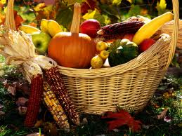 A basket filled with autumn vegetables and Indian corn.