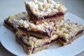 Stack of crumb-topped berry dessert bars.