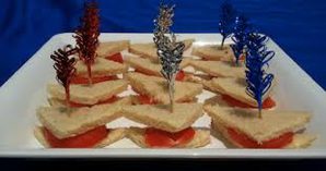 Sandwiches with decorative picks on a platter.