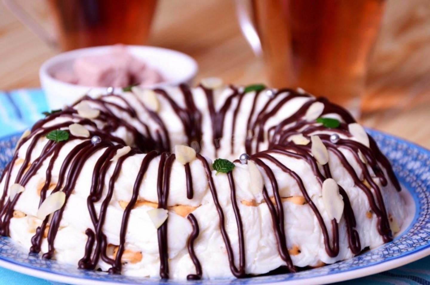 Bundt cake drizzled with chocolate glaze on a plate.