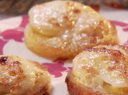 Close-up of glazed cinnamon sugar pastries on a pink plate.