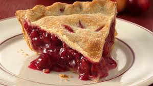 A slice of cherry pie with a golden crust and juicy filling.
