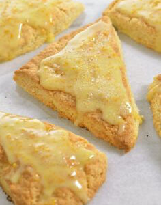 Golden, triangular scones with a sugar glaze.