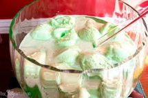 A bowl of green ice cream with a spoon.