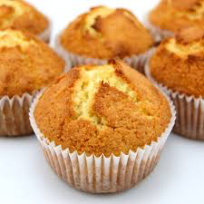 Golden-brown freshly baked muffins in white paper liners.