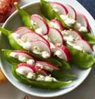 Snow peas stuffed with a creamy cheese and radish slices.